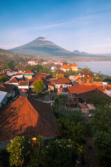 Scenic panorama of Amed village at sunrise with Agung volcano, Bali, Indonesia
