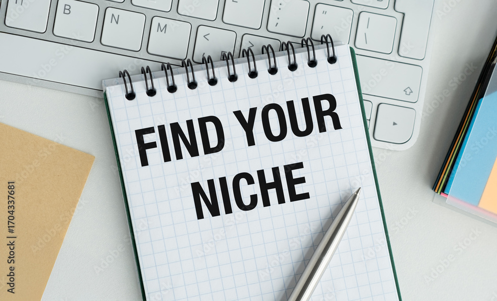 Poster A notebook with the words Find Your Niche written on it