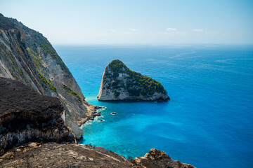 Obraz premium Plakaki Zakynthos Island Greece coastline with turquoise sea green cliffs and rocky formations breathtaking coastal scenery and photo spot
