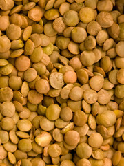 Close up of dry green lentils in bulk