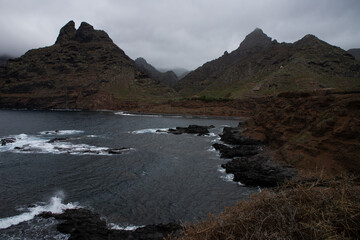 Dramatic coastal cliffs with crashing waves under a moody sky. Rugged, untouched nature at its rawest, perfect for nature and travel themes.