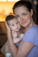 Middle aged mother and her infant daughter