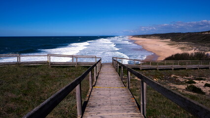 Fototapeta premium Path over the wooden walkway to the ocean