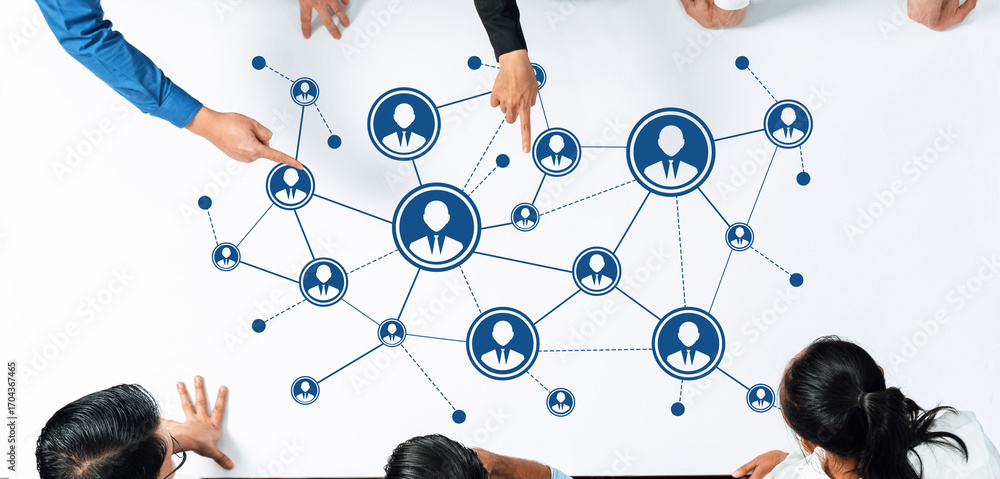 Poster a diverse group of professionals gathers around a table, discussing networking strategies illustrate