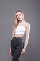 Beauty portrait of young beautiful blonde model with bare shoulders