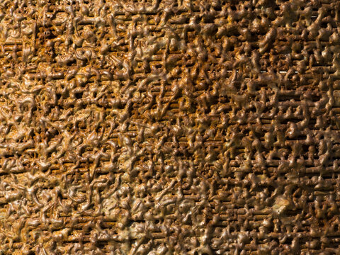 Rusty corroded metal wire mesh with textured surface closeup