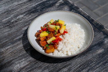 Chicken with pineapple in teriyaki sauce with fried rice. 