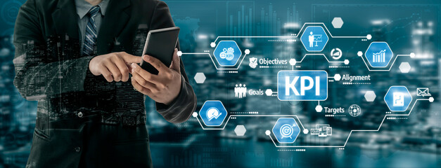 A businessman engages with his smartphone to track key performance indicators against a vibrant cityscape, emphasizing critical aspects of business performance and strategy. Tessel