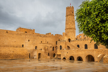 Fototapeta premium Inner yards and walls of Ribat of Monastir under cloudy skies, Monastir, Monastir Governorate, Tunisia
