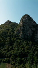 Drone shot of Jerma Canyon fields and rocky cliffs surrounded by forest in Serbia. Aerial vertical view