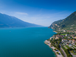 Fototapeta premium Garda lake panoramic view. Aerial view of lake Garda and Limone sul Garda surroundings. Lombardy drone landscape
