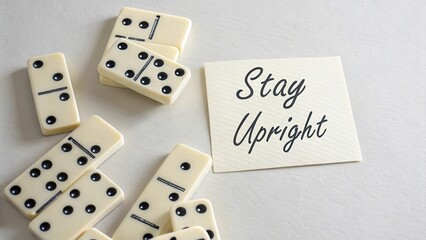 Simple Stay Upright Message with Dominoes on Light Background