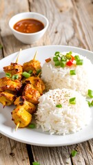 Grilled skewers with rice and dipping sauce