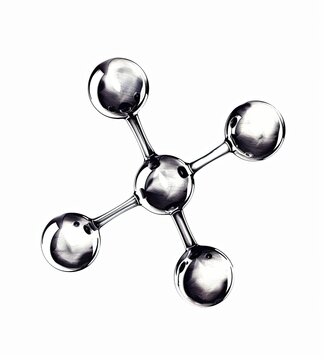 A stylized, metallic, four-armed molecule model, rendered in grayscale with reflective surfaces, isolated on a pure white background