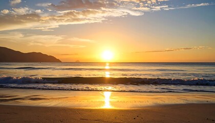 Golden sunrise over tranquil beach