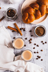 Yemeni coffee with spices and cream in glasses and crispy bread top and vertical view