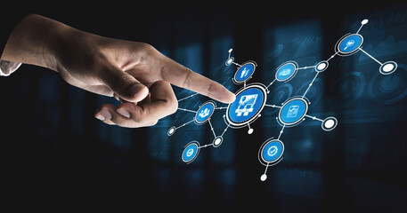 A close-up of a hand pointing at digital icons showcasing various technology concepts like data analysis and communication, illustrating modern digital interaction. Tessel