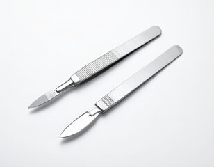 Fototapeta premium Two Stainless Steel Scalpels on White Background, Medical Instruments, Sharp Blades.
