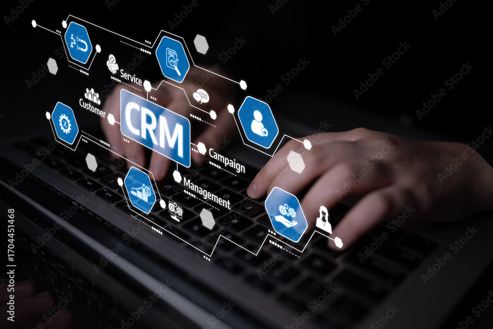 Poster a close-up view of hands typing on a laptop, surrounded by crm icons that symbolize customer relatio
