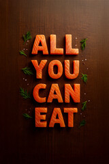 A top-down shot of fresh salmon pieces on a wooden table spelling out All you can eat. This creative food art for special offers for restaurants