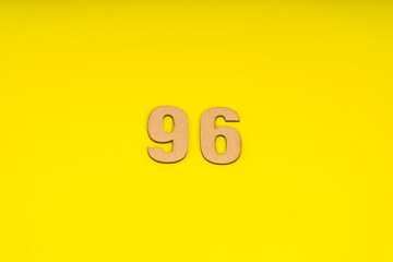 Number ninety-six on yellow background