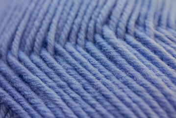 Close-up Blue Wool knitted Texture background. Blue Yarn threads abstract background. Blue knitting yarn textured backdrop.