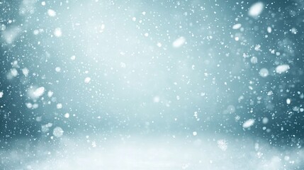 Fototapeta premium Soft blue background with falling snowflakes