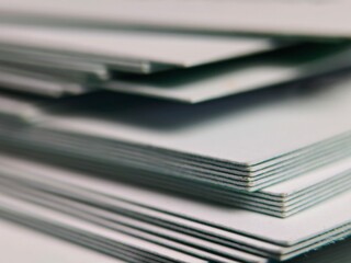 Stack of White Paper Sheets CloseUp Office Supplies Business Documents.