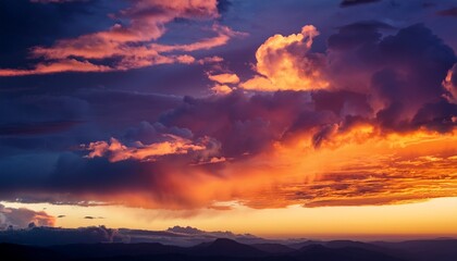 Obraz premium Colorful Clouds Illuminated By A Warm Sunset Sky With Shades Of Orange And Purple