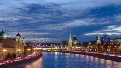 Obraz premium Ensemble of Moscow Kremlin and Moskva-City business center view across Moskva river at a winter day to night timelapse hyperlapse