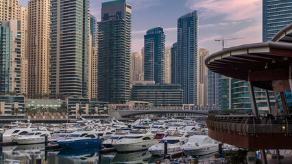 Dubai Marina at Blue hour night to day timelapse with yachts