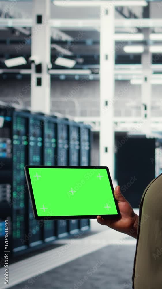 Poster vertical video developer in data center using isolated screen tablet to upgrade systems for increase