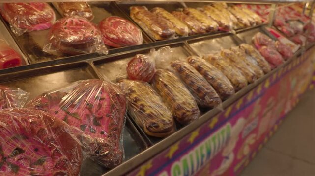 Heart Shaped Pink Pan Dulce Wrapped on Tray at Feria 3053