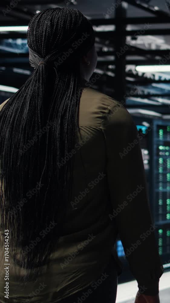 Poster vertical video programmer overseeing high tech server farm, ensuring compliance with industry standa