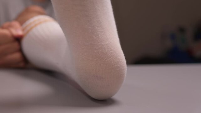 Taking off a Foot Sock that has a Hole for Enhanced Comfort and Better Wear Experience