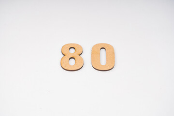 Number eighty on paper on a white background.