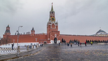 Fototapeta premium View of The Saviour Spasskaya Tower timelapse hyperlapse and Kremlin walls of Moscow Kremlin, Russia at day in winter.