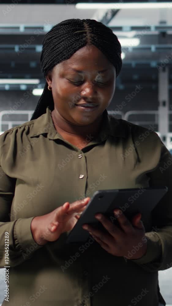 Aufkleber vertical video data center programmer monitors data center metrics on tablet to enhance gear operati