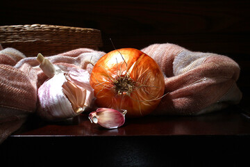 Onion and garlic on the dark background, Brazilian spices.