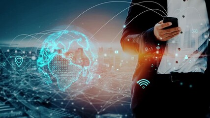 A businessman stands in an urban environment, holding a smartphone while surrounded by a futuristic global network visualization, symbolizing communication and connectivity innovations. Xenic - Powered by Adobe