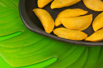 Delicious traditional Colombian empanadas with spicy sauce