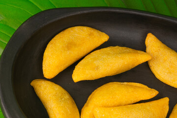 Colombian empanada with spicy sauce 