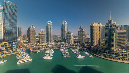 Fototapeta premium Dubai Marina skyscrapers aerial all day timelapse, port with luxury yachts and marina promenade