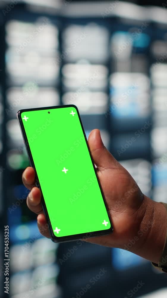 Aufkleber vertical video employee using app on mockup mobile phone to check server hub energy consumption. dat