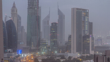 Fototapeta premium Dubai downtown skyline night to day aerial timelapse with traffic on highway