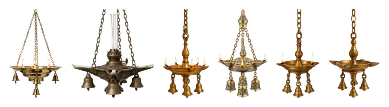 Traditional brass Indian oil lamp set including hanging deepam, chain lamps, and lit diya isolated. Cultural and religious decoration.