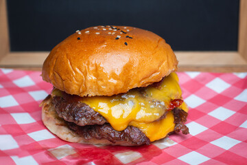 Juicy beef cheeseburger with melted cheddar cheese.