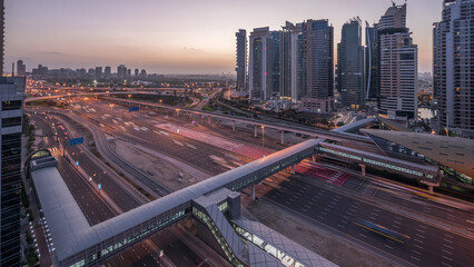 Aerial top view to Sheikh Zayed road near Dubai Marina and JLT night to day timelapse, Dubai.
