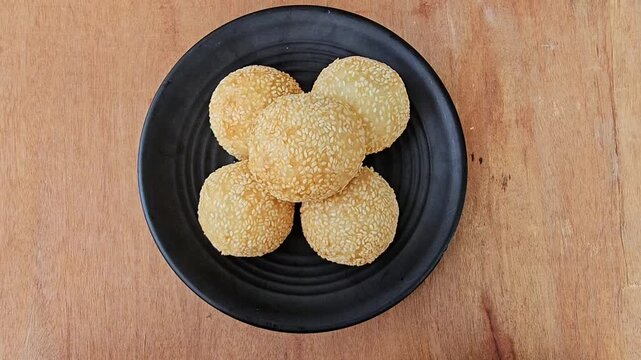 heart shaped cookies Sesame balls or Onde onde or Jiandui or Kue moci or Kuih bom,a type of Chinese pastry,made from glutinous rice,coated with sesame seeds,filled with a filling usually beans,served 