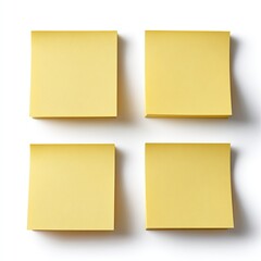 Four blank, pale-yellow square sticky notes arranged in a 2x2 grid on a white background, casting slight shadows